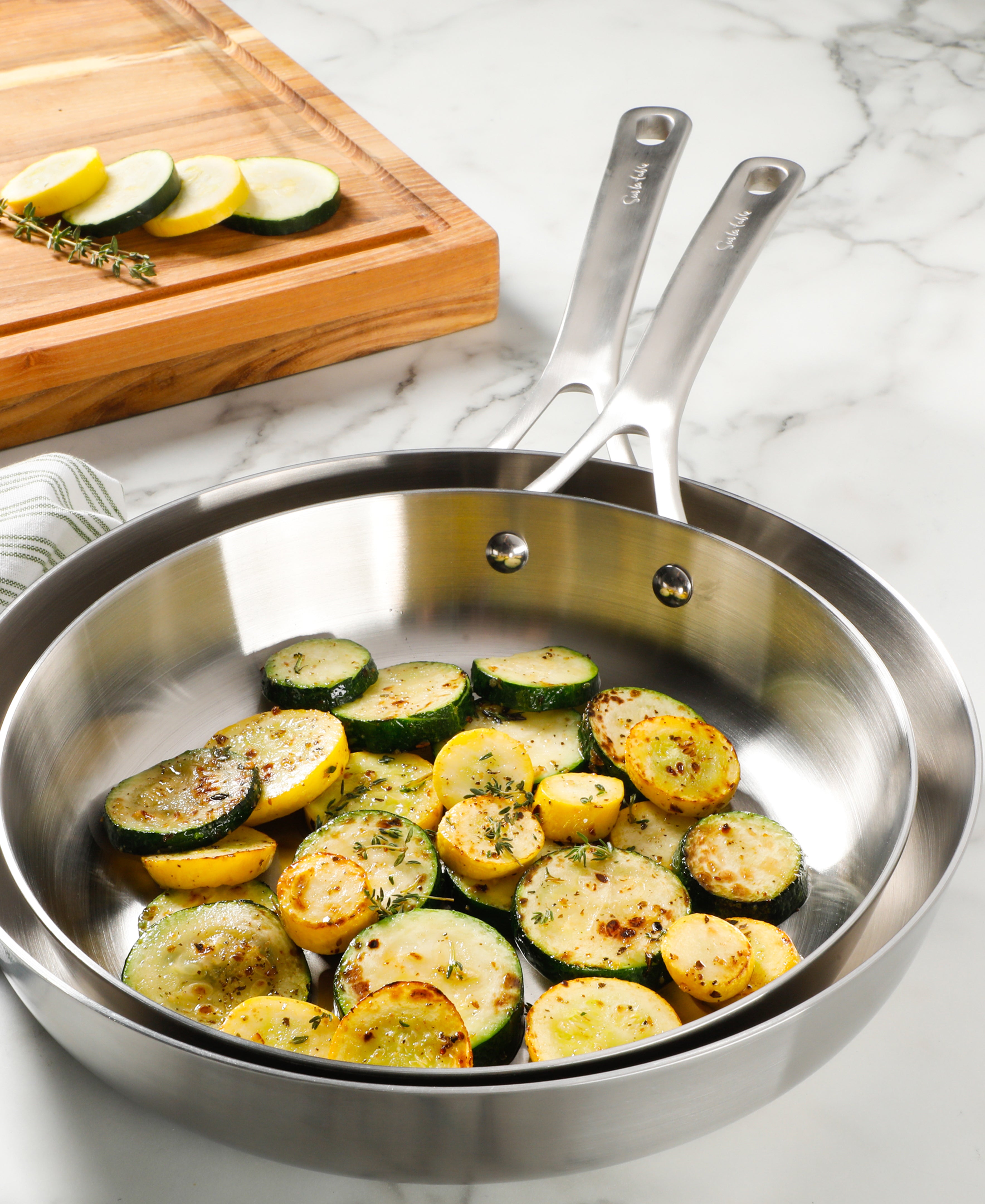 Sur La Table Pike and Pine 2-Piece 10 & 12 Inch Triply Stainless Steel Fry Pan Set w/ Stainless Steel Lids and Cast Handles