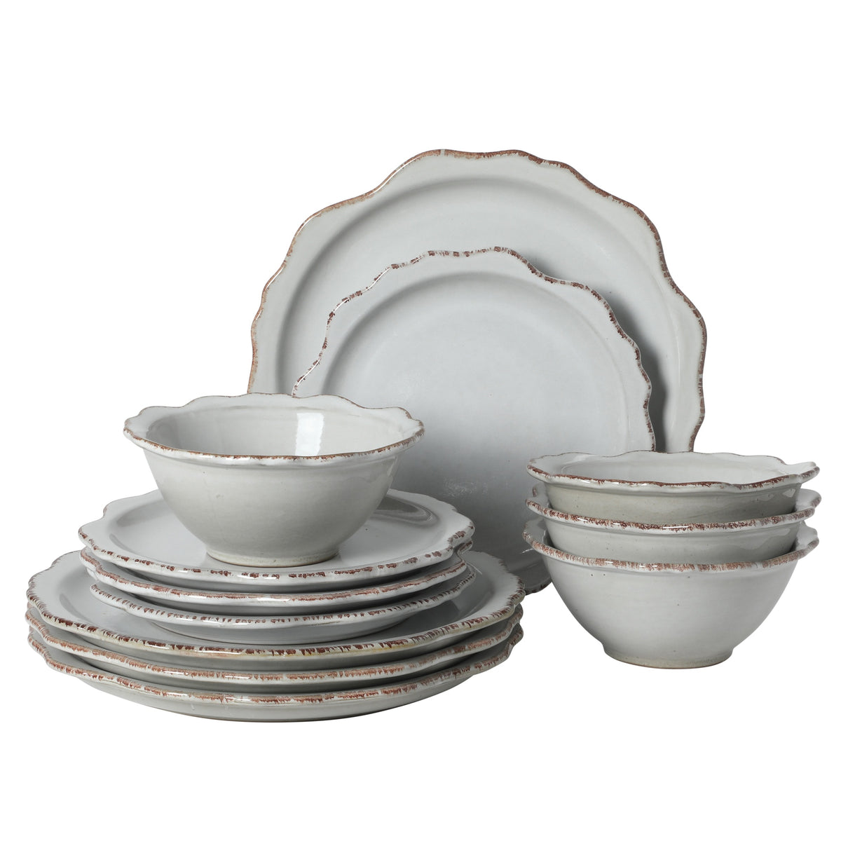Gibson Elite Kennon Road 12-piece stoneware dinnerware set, white with an irregular scalloped edge and a distressed reddish-brown rim trim, reactive glaze.