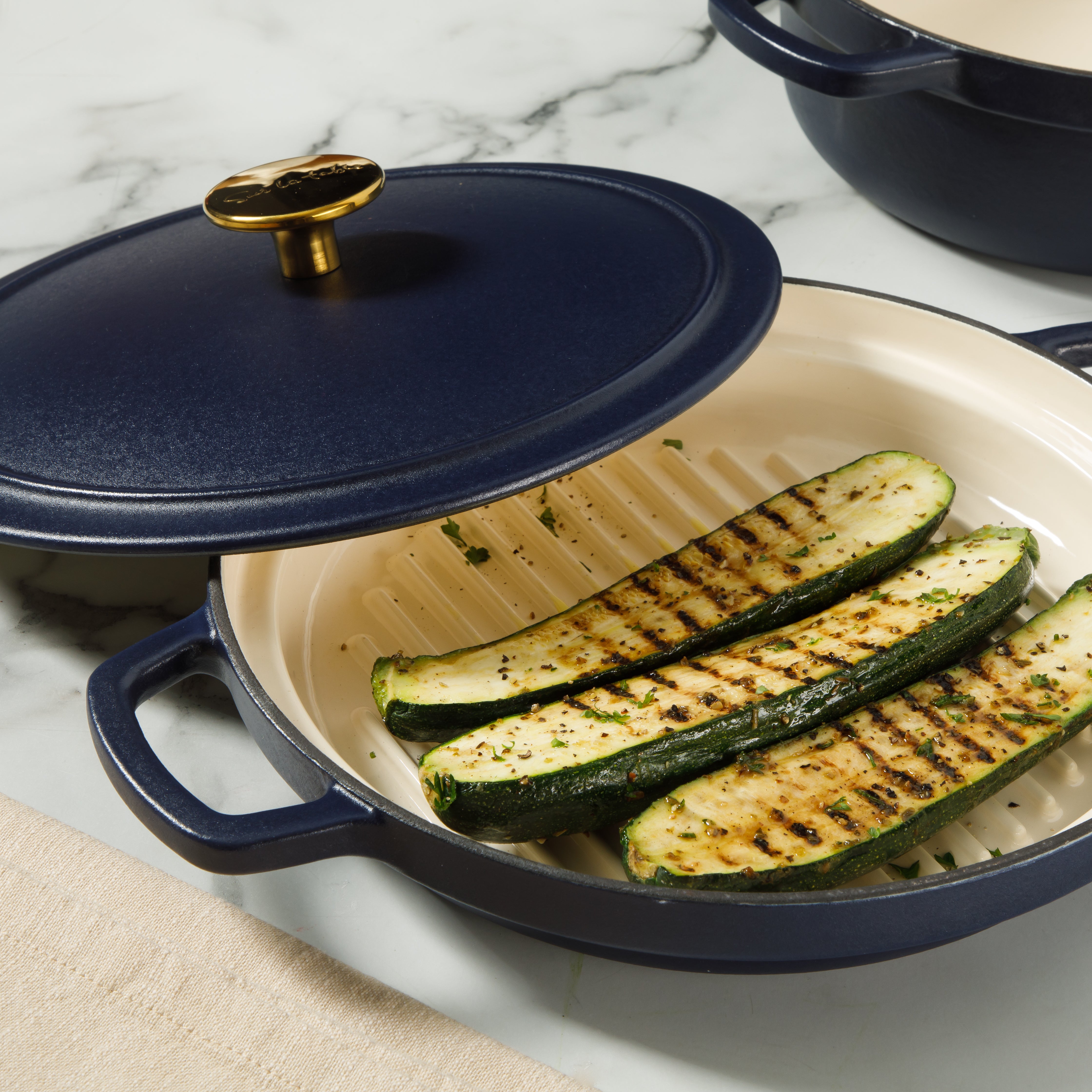 Sur La Table Kitchen Essentials 4-Piece Enameled Cast Iron Stackable Cookware Set, 5.3 Qt Dutch Oven with Lid, Braiser & Grill Pan, Navy Blue, Gold Knob Oven Safe to 500°F, Induction Compatible