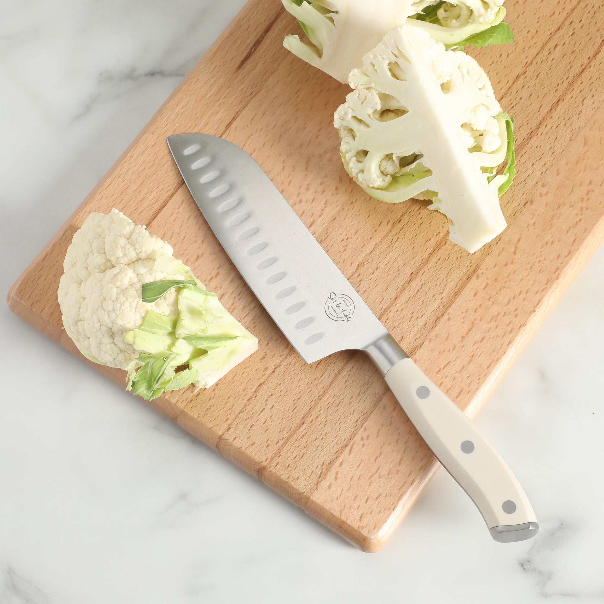 Sur La Table Kitchen Essentials Tasting Kitchen German Steel Santoku Knife, 7-Inch Stainless Steel Blade – Professional Kitchen Knife with White Handle and Forged Full Tang